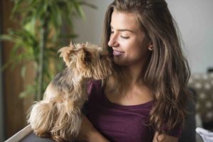 Strong bond between a woman and her cute dog.